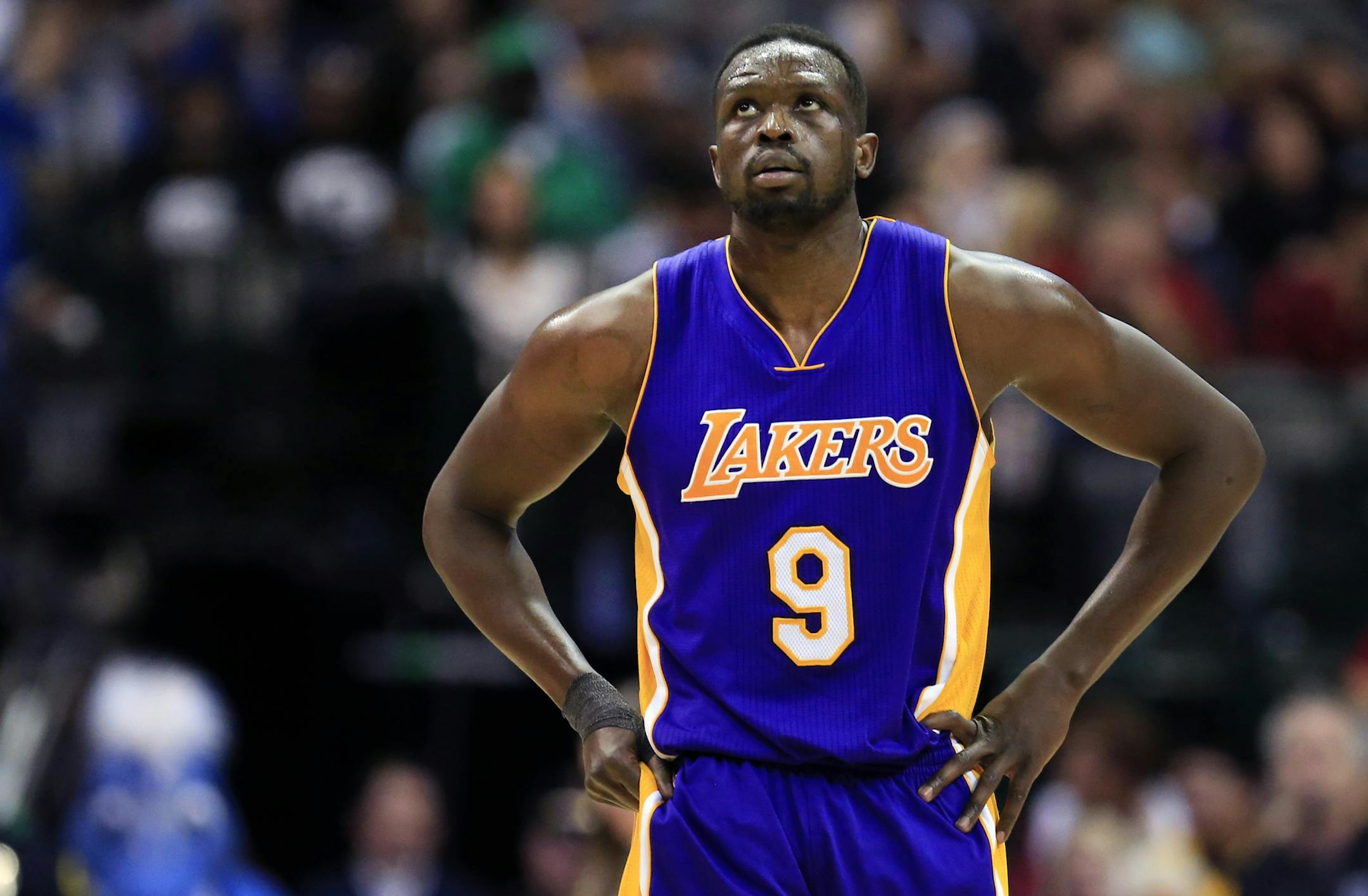 Los Angeles Lakers forward Luol Deng (9) walks toward the bench during the second half of an NBA basketball game against the Dallas Mavericks, Sunday, Jan. 22, 2017, in Dallas. (AP Photo/Ron Jenkins) ORG XMIT: TXRJ116