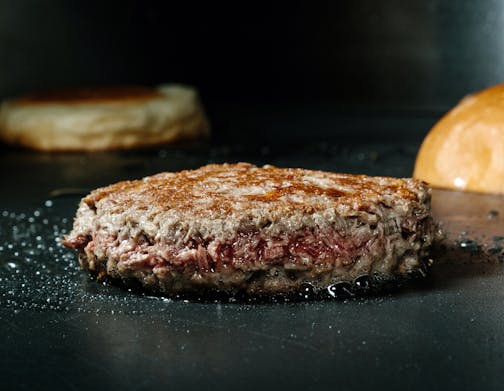 FILE -- An Impossible Foods meatless burger on the grill at the company's headquarters in Redwood City, Calif., on Dec. 23, 2016. Burger King is introducing a version of its iconic Whopper sandwich filled with a vegetarian patty from the California-based startup. (Jason Henry/The New York Times)