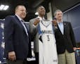 Minnesota Timberwolves first-round draft pick Kris Dunn, center, posed for photos with head coach and president of basketball operations, Tom Thibodea