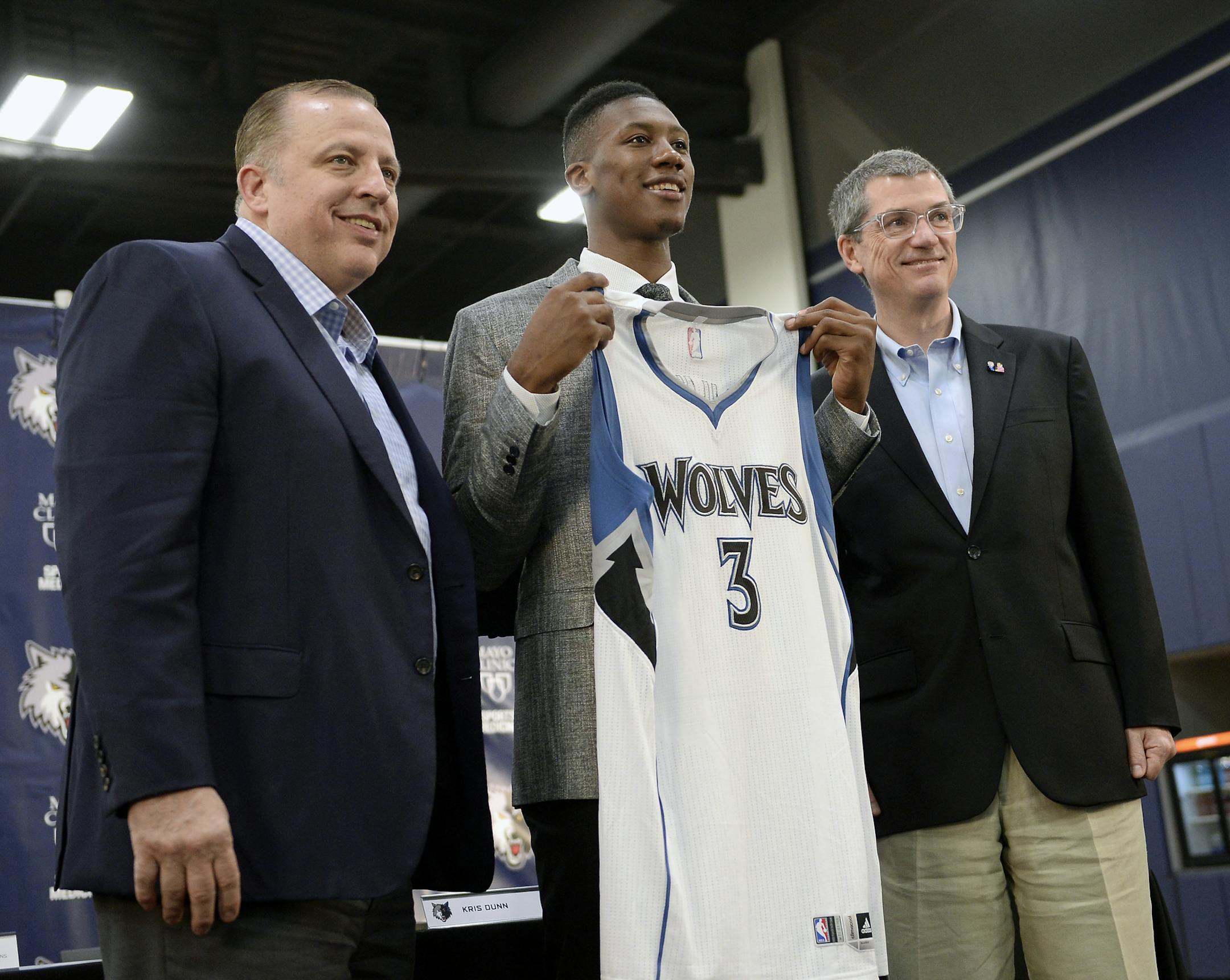 Minnesota Timberwolves first-round draft pick Kris Dunn, center, posed for photos with head coach and president of basketball operations, Tom Thibodeau, left, and general manager Scott Layden.