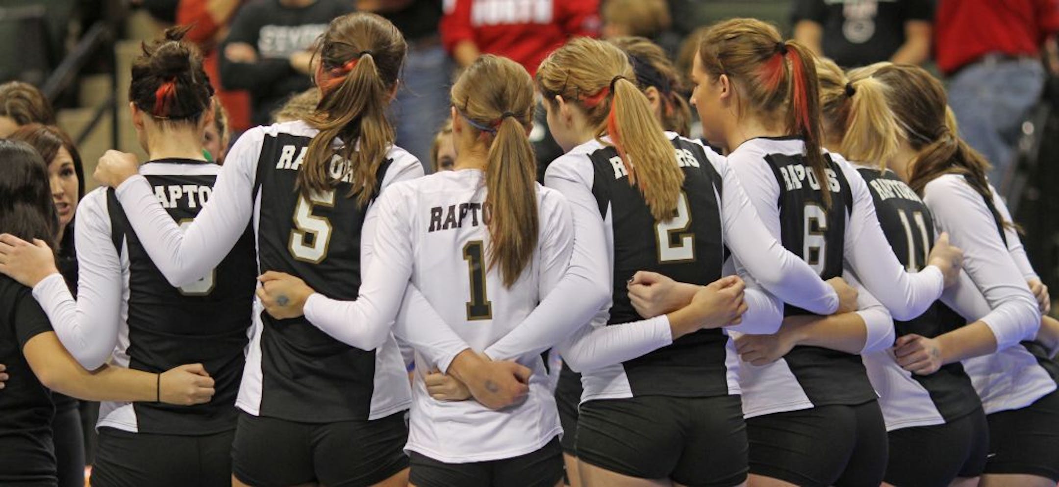 The East Ridge Raptors linked arms during a time out last season.