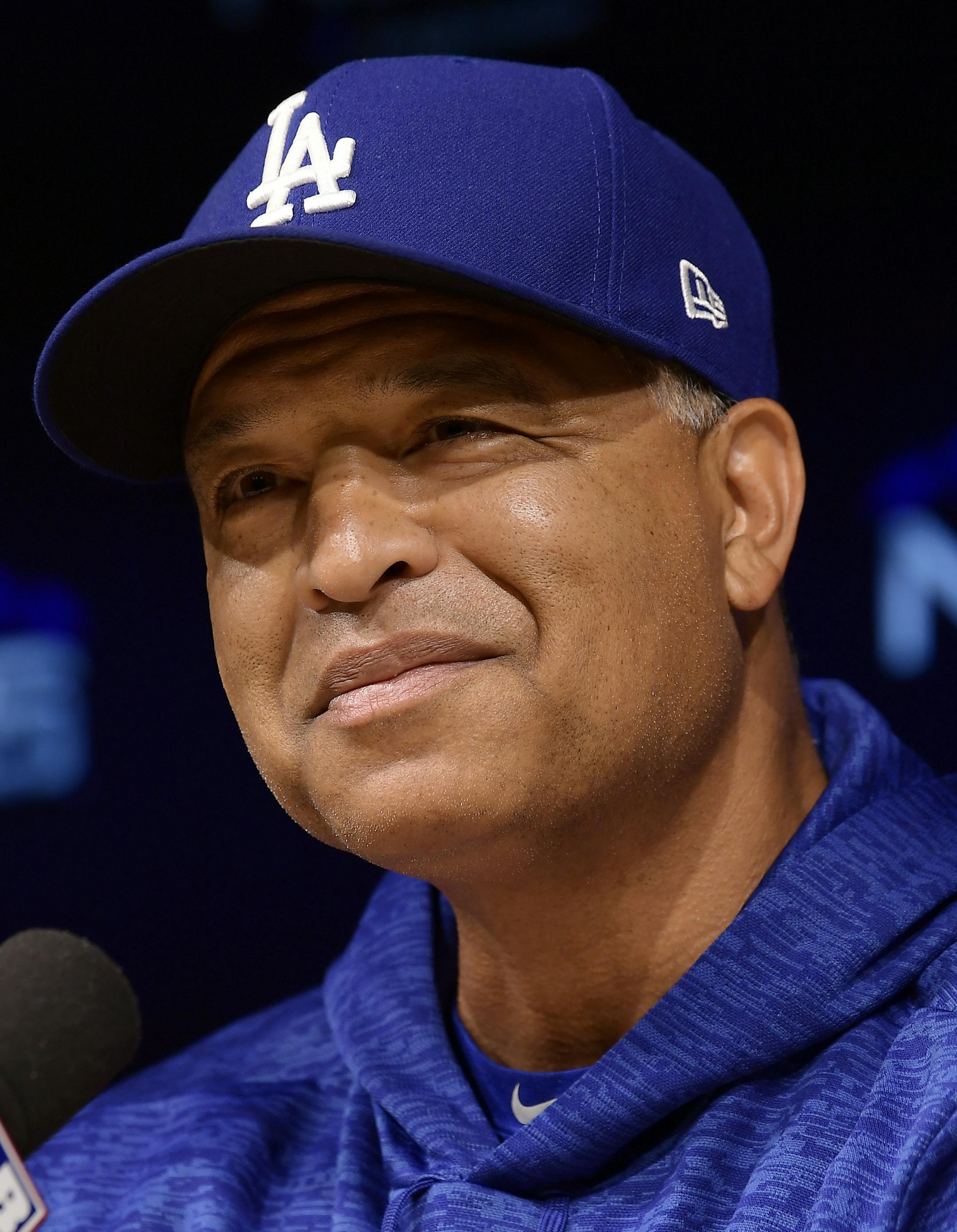Los Angeles Dodgers manager Dave Roberts takes a question during a news conference prior to practice for Game 1 of the baseball team's NLCS against the Milwaukee Brewers, Wednesday, Oct. 10, 2018, in Los Angeles. (AP Photo/Mark J. Terrill)