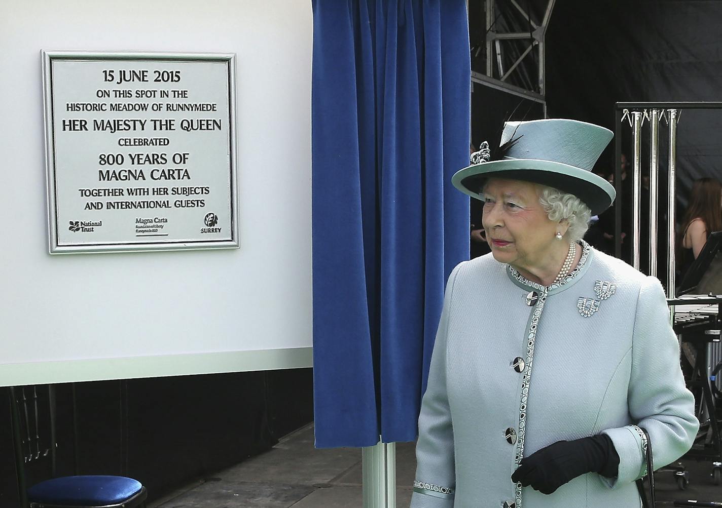 Britain's Queen Elizabeth II unveils a plaque at Runnymede, England, during a commemoration ceremony Monday June 15, 2015, to celebrate the 800th anniversary of the groundbreaking accord called Magna Carta. In 1215, Britain's King John met disgruntled barons at Runnymede and agreed to a list of basic rights and laws called the Magna Carta, which have formed the basic tenets of modern civil liberties, and was an inspiration for the U.S. Constitution among many other worldwide influences. (Chris J