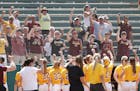 Gopher team celebrated with their fans after a win gainst the Louisiana Tech catcher during the regional