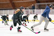 Margo Biestuzheva, 9, skated up and down the ice with her teammates during hockey practice at Minnehaha Ice Arena.
