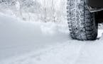Winter Tyre on snow covered road.