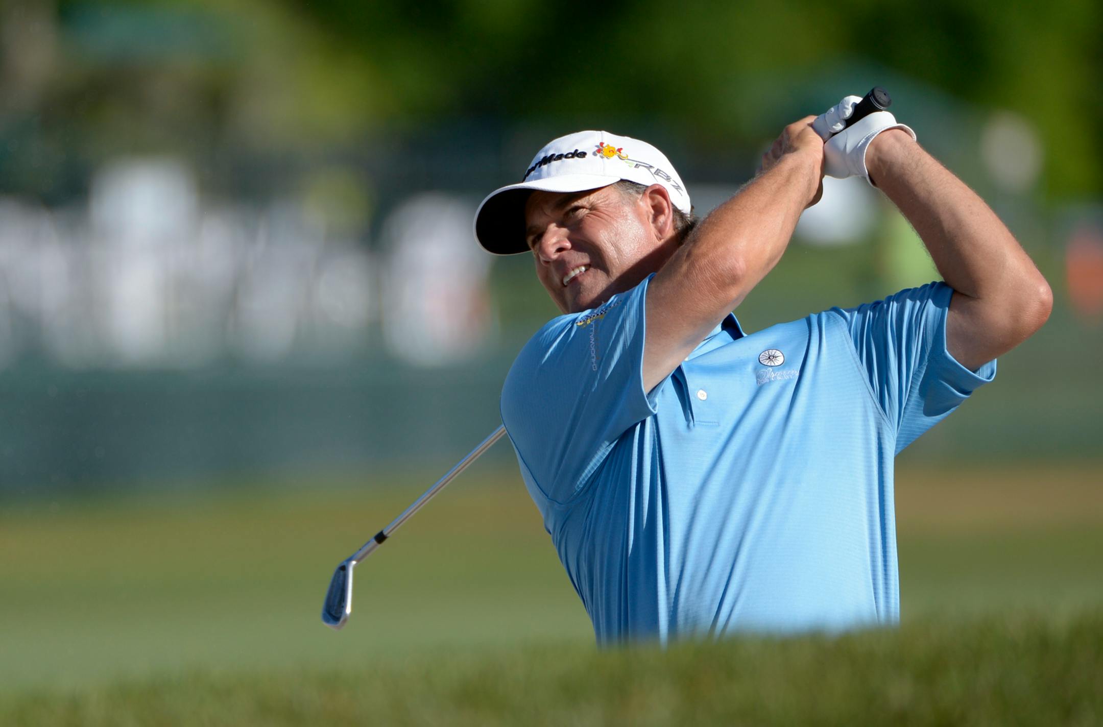 Scott McCarron watches his shot from a bunker on the ninth fairway during the second round of the Arnold Palmer Invitational golf tournament at Bay Hill in Orlando, Fla., Friday, March 23, 2012.(AP Photo/Phelan M. Ebenhack)