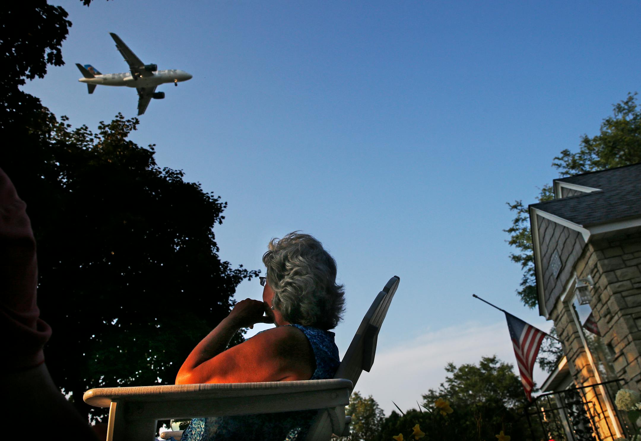 In this photo from July, Lori Moen sat in her back yard on 21st Av. S. and E. 56th Street and watched as an airplane approached MSP.