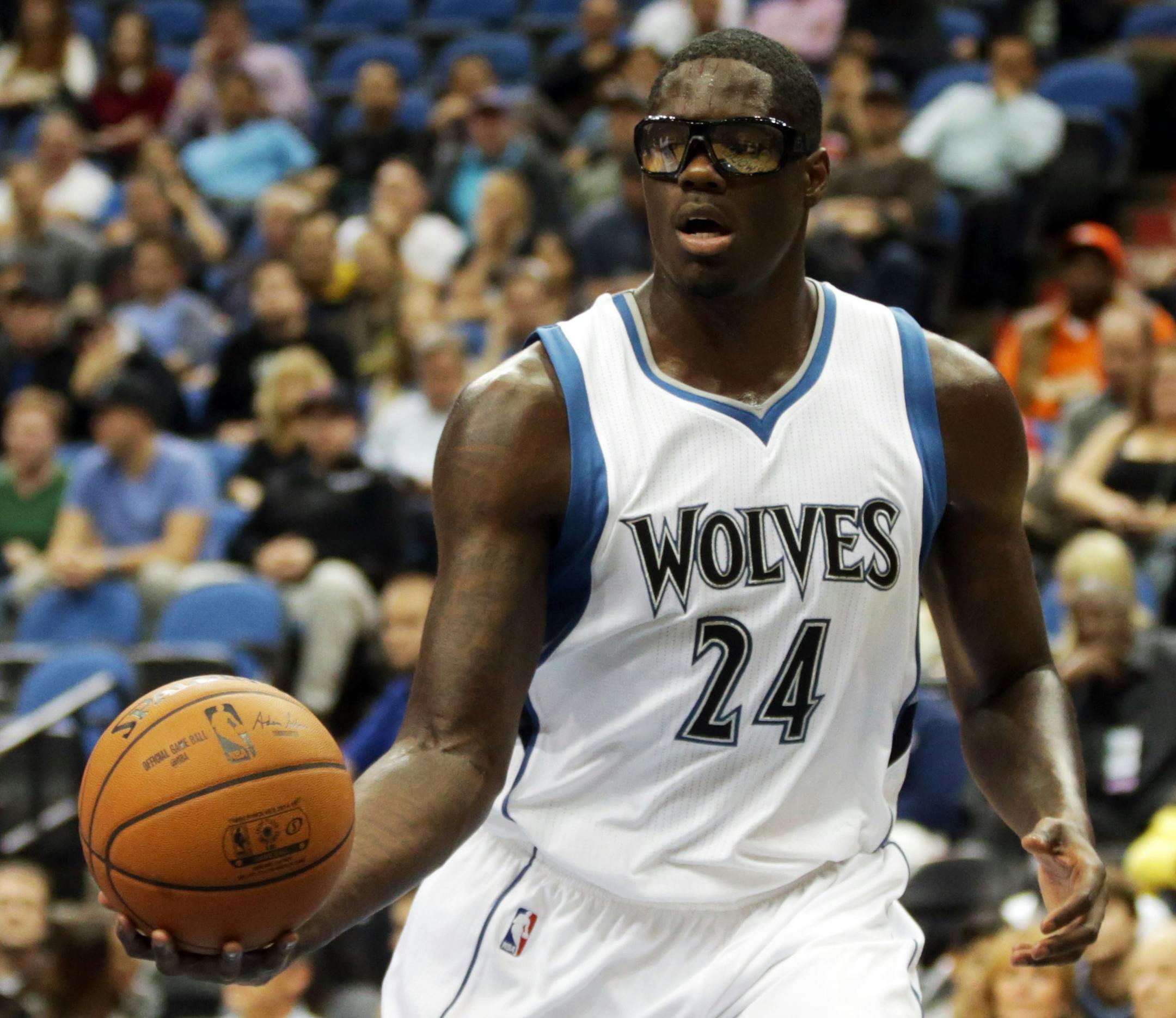 Minnesota Timberwolves' Anthony Bennett catches the ball in the second of an NBA preseason basketball game against the Philadelphia 76ers, Friday, Oct. 10, 2014, in Minneapolis. The Timberwolves won 116-110. (AP Photo/Jim Mone)