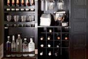 Crate & Barrel's Steamer Bar cabinet ($999) folds out to a full 72-inch bar.