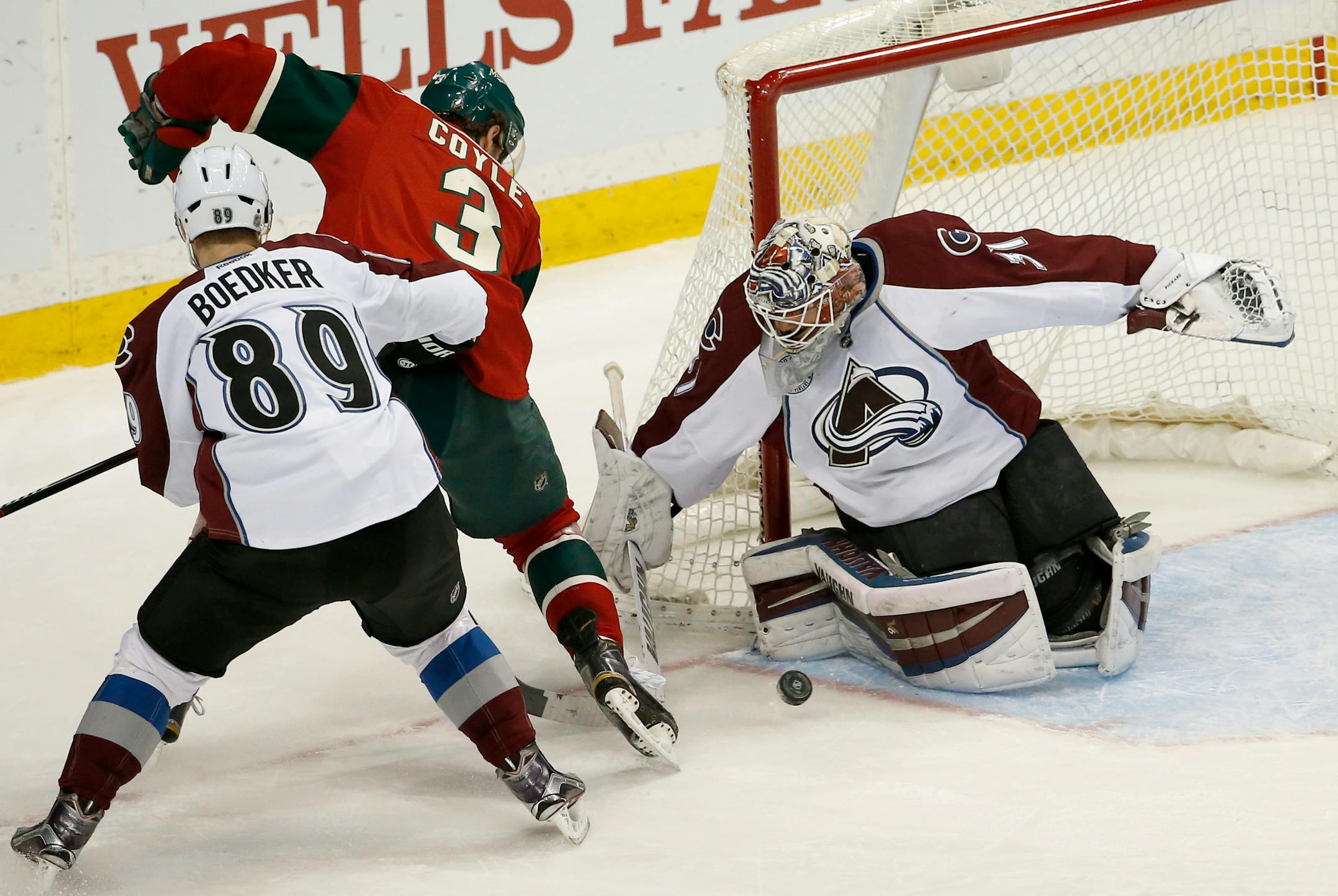 Colorado Avalanche goalie Calvin Pickard (31) stops a shot by Minnesota Wild center Charlie Coyle (3) in front of Avalanche left wing Mikkel Boedker (89), of Denmark, during the third period of an NHL hockey game in St. Paul, Minn., Tuesday, March 1, 2016. The Wild won 6-3. (AP Photo/Ann Heisenfelt)