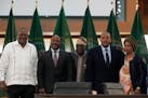 From left, Kenya's former president Uhuru Kenyatta, lead negotiator for Ethiopia's government, Redwan Hussein, African Union envoy Olusegun Obasanjo, 