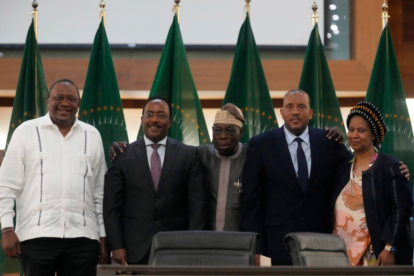 From left, Kenya's former president Uhuru Kenyatta, lead negotiator for Ethiopia's government, Redwan Hussein, African Union envoy Olusegun Obasanjo, lead Tigray negotiator Getachew Reda, and former South Africa's vice president Phumzile Mlambo-Ngcuka pose after the peace talks in Pretoria, South Africa, Wednesday, Nov. 2, 2022. Ethiopia's warring sides have formally agreed to a permanent cessation of hostilities, an African Union special envoy said Wednesday, after a 2-year conflict whose victims could be counted in the hundreds of thousands. (AP Photo/Themba Hadebe)