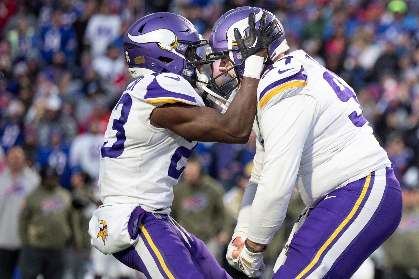 Minnesota Vikings cornerback Andrew Booth Jr. (23) left andMinnesota Vikings defensive tackle Harrison Phillips (97) celebrated linebacker Eric Kendricks (54) fumble recovery for a touchdown in Orchard Park.,N.Y.Sunday November 13, 2022.