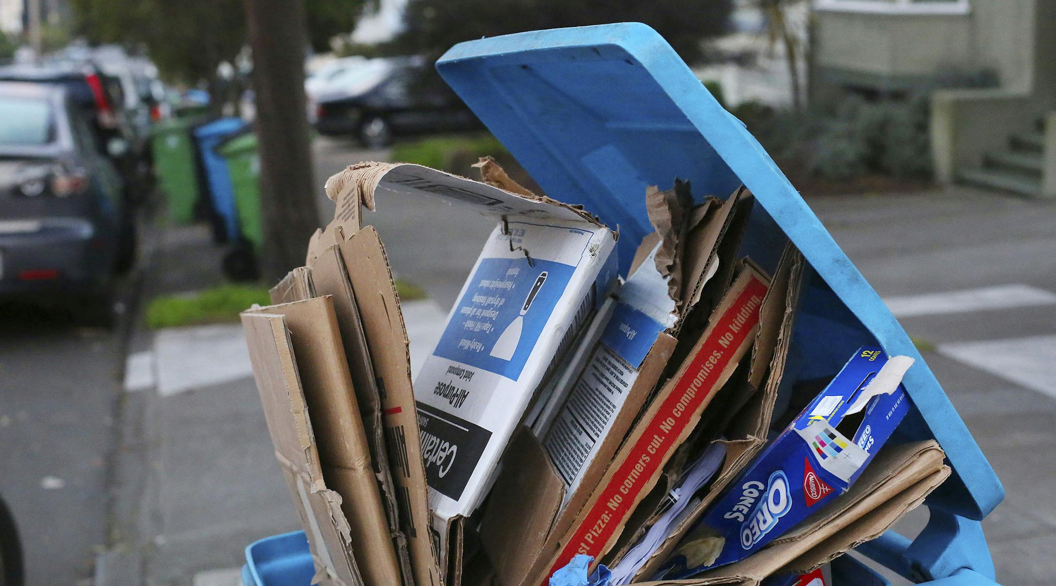 Cardboard overflows from a recycling bin in San Francisco, Jan. 28, 2016. Delivery services now come through in hours, not days. But the boxes after boxes generated are creating environmental concerns, and some guilt. (Jim Wilson/The New York TImes) ORG XMIT: MIN2016042812294708