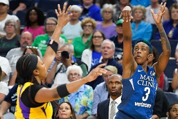 Lynx point guard Danielle Robinson, shooting over Sparks guard (and now teammate) Odyssey Sims of the Sparks last season, has made only three three-po