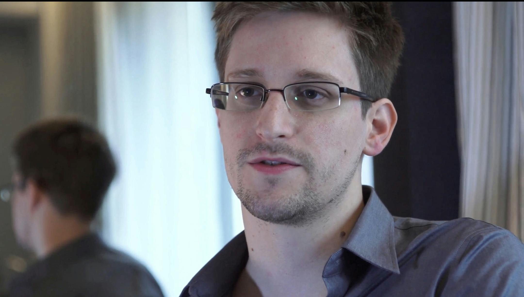 FILE - This Sunday, June 9, 2013 file photo provided by The Guardian Newspaper in London shows Edward Snowden, in Hong Kong. Russian state news agency said Wednesday, July 24, 2013 that US leaker Edward Snowden has been granted a document that allows him to leave the transit zone of a Moscow airport and enter Russia. Snowden has applied for temporary asylum in Rusia last week after his attempts to leave the airport were thwarted. The United States wants him sent home to face prosecution for espi