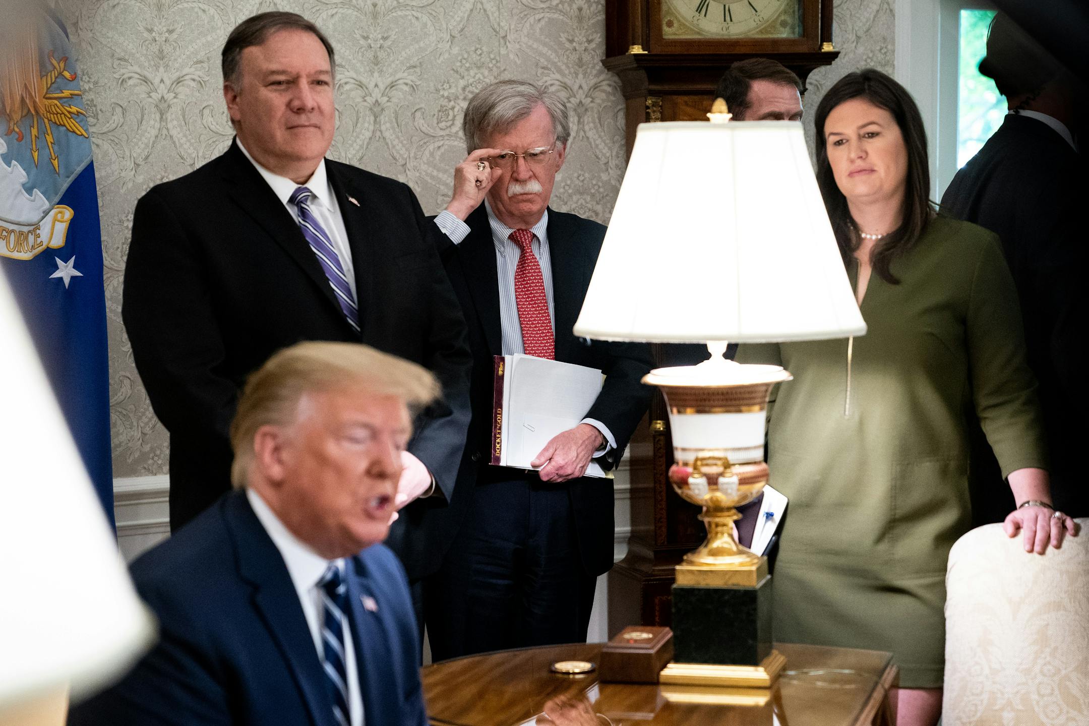 Secretary of State Mike Pompeo, right, and national security adviser John Bolton looked on as President Donald Trump spoke during a meeting last week in the Oval Office.