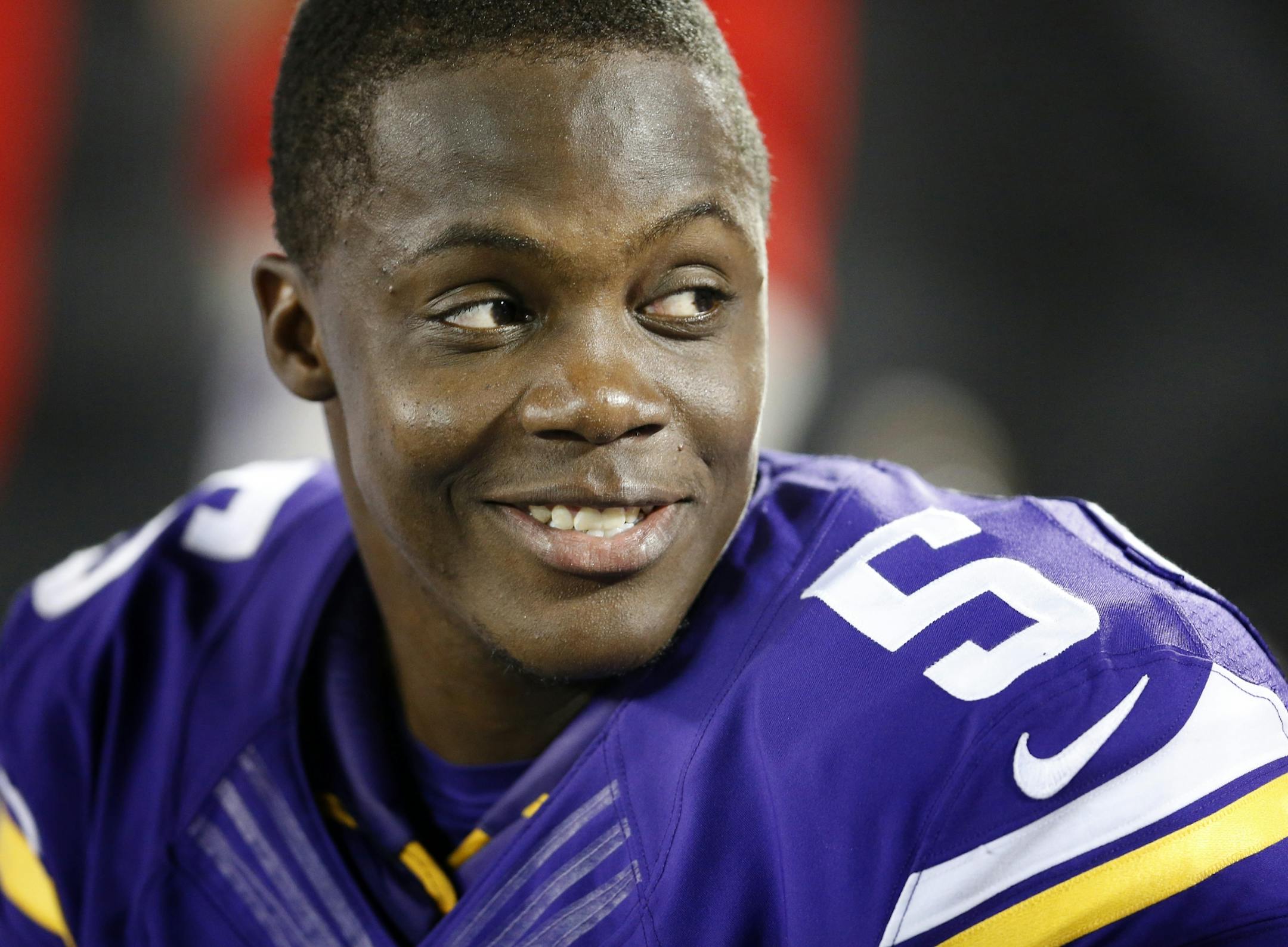 Teddy Bridgewater (5) smiled while talking to teammates on the bench after leading a go a head drive late in the fourth quarter.