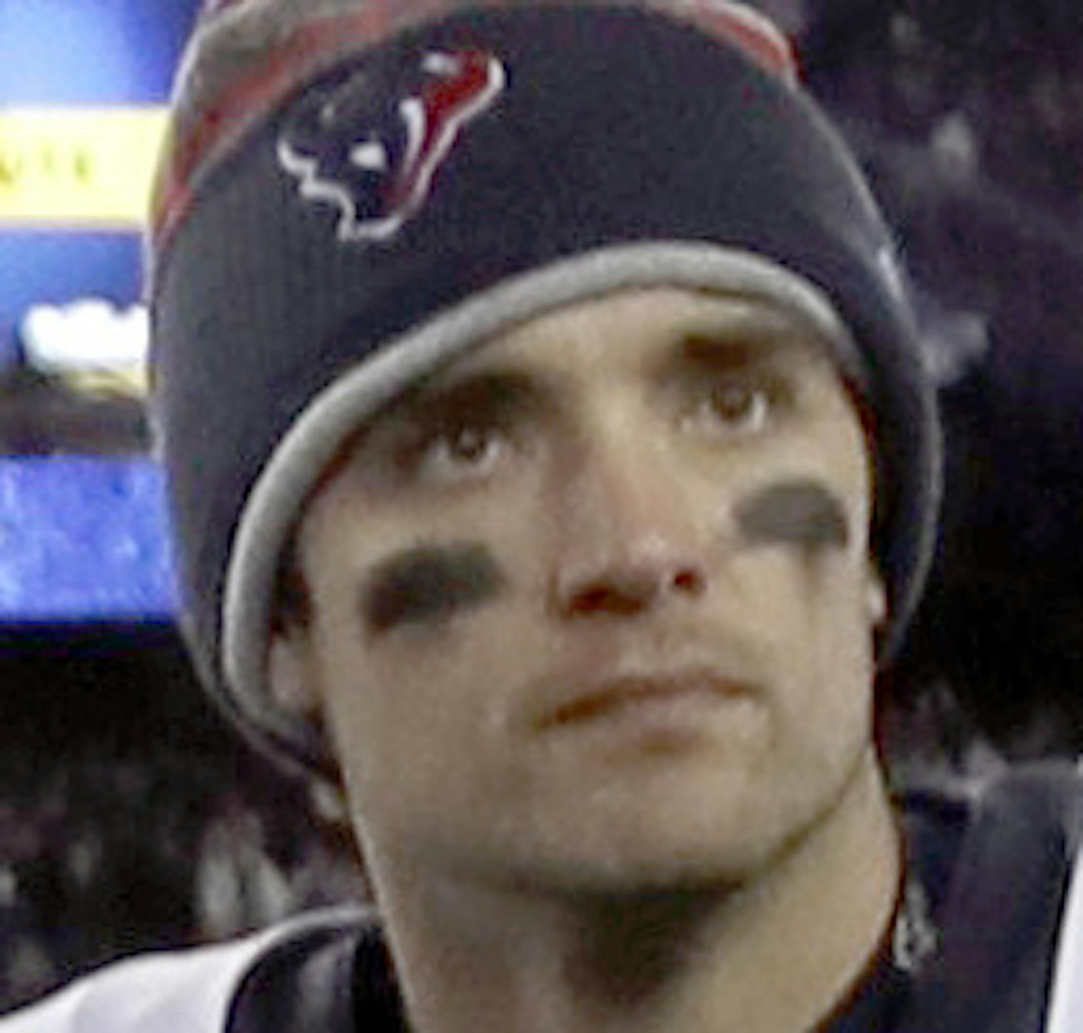 New England Patriots quarterback Tom Brady (12) and Houston Texans quarterback Brock Osweiler (17) pass at midfield after an NFL divisional playoff football game, Saturday, Jan. 14, 2017, in Foxborough, Mass. (AP Photo/Charles Krupa)
