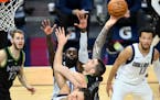 Minnesota Timberwolves forward Juancho Hernangomez (41) attacked the rim but missed as he was fouled by Dallas Mavericks center Dwight Powell (7) in t