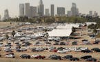 Vehicles wound through the parking lots at Los Angeles Dodger Stadium in February. The setting was one of the largest vaccination sites in the country