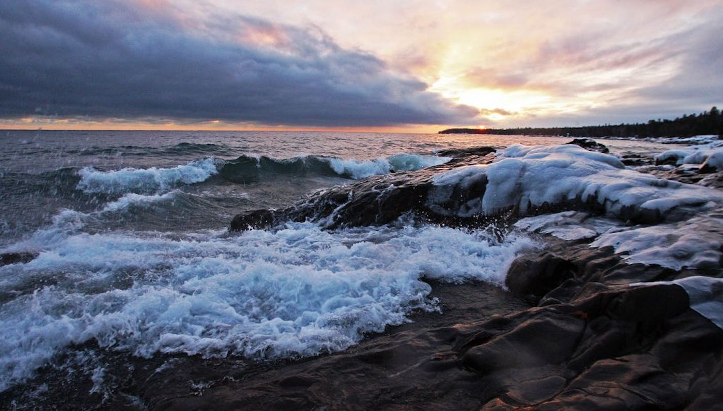 Winter scene along Lake Superior shoreline at sunset
