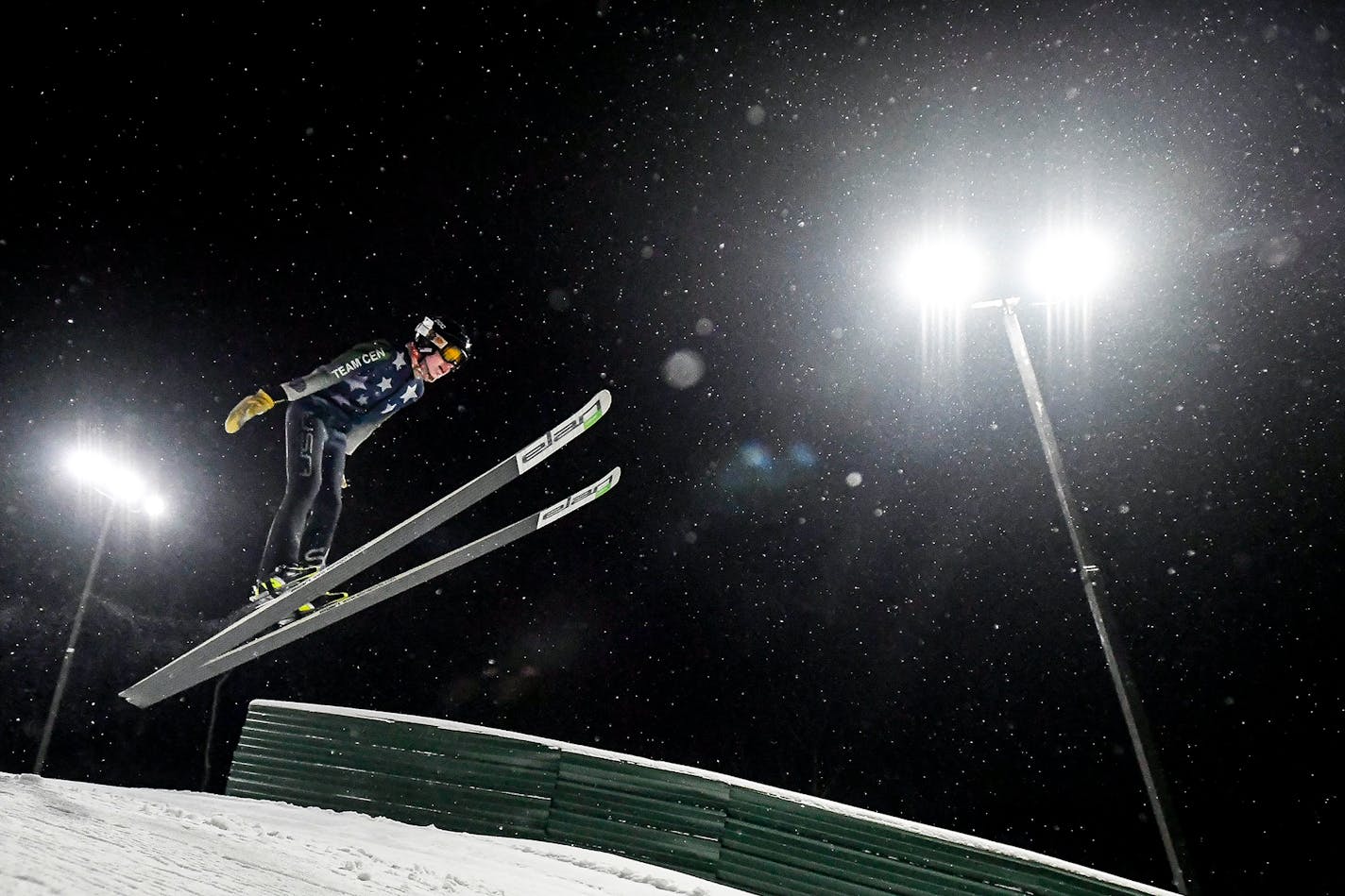 Finn Cherveny, 13, of Minneapolis, practiced his ski jumping Tuesday night in Bloomington on the 25-meter jump. Cherveny has been ski jumping for two years.