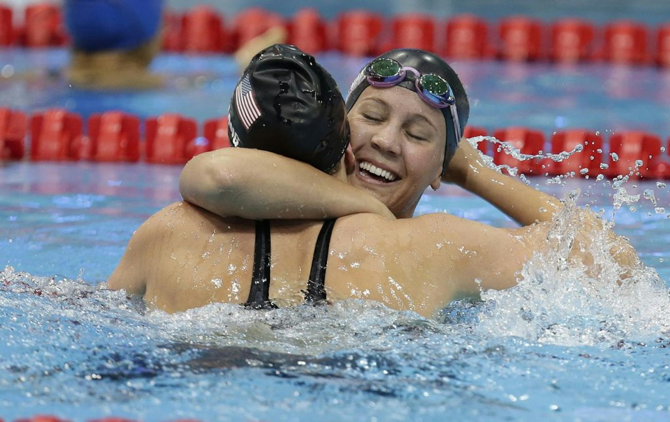 Mallory Weggemann, right, of the United States celebrates with teammate Jessica Long after winning the women's 50-meter freestyle S8 final at the 2012 Paralympics games, Sunday, Sept. 2, 2012, in London.