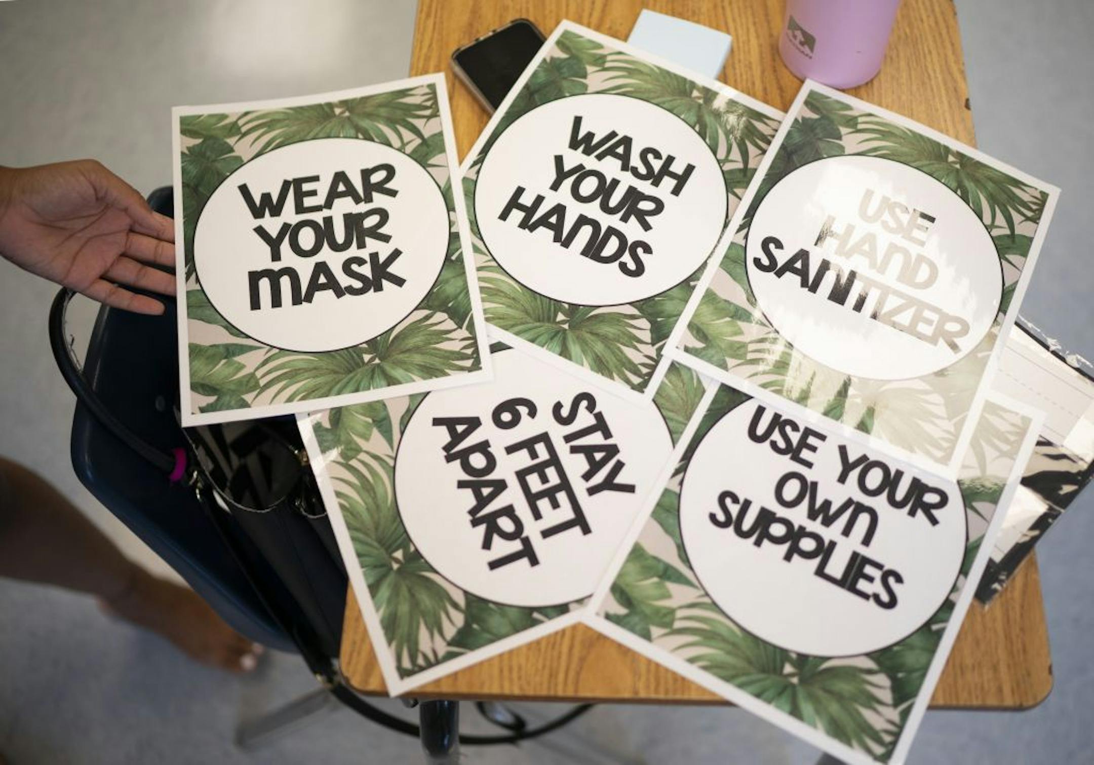 First year teacher Gabrielle Brown made signs to remind her second grade students about COVID-19 precautions at Friendship Academy for the Arts.