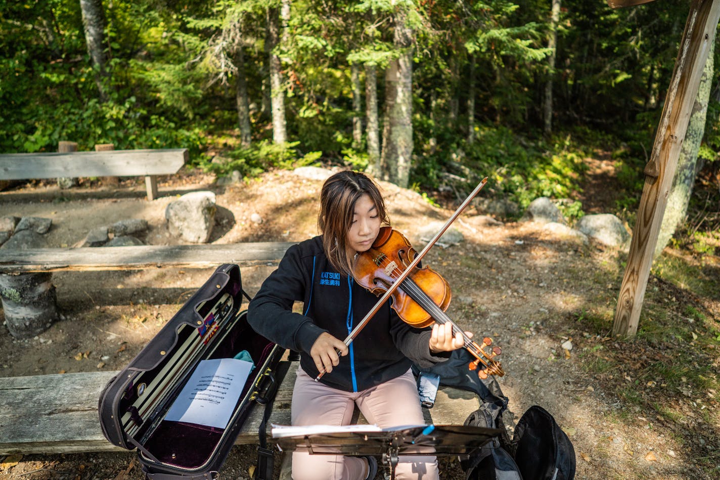 Emilia Yoon, of Arizona, practices in the solitude of the lake-shore amphitheater. ] MARK VANCLEAVE &#xa5; mark.vancleave@startribune.com * The Northern Lights Chamber Music Institute brings young musicians from across the world to the shores of Lake Vermillion to refresh their craft with &#x201c;nature&#x2019;s oxygen.&#x201d; Photographed Wednesday, Aug. 22, 2018.