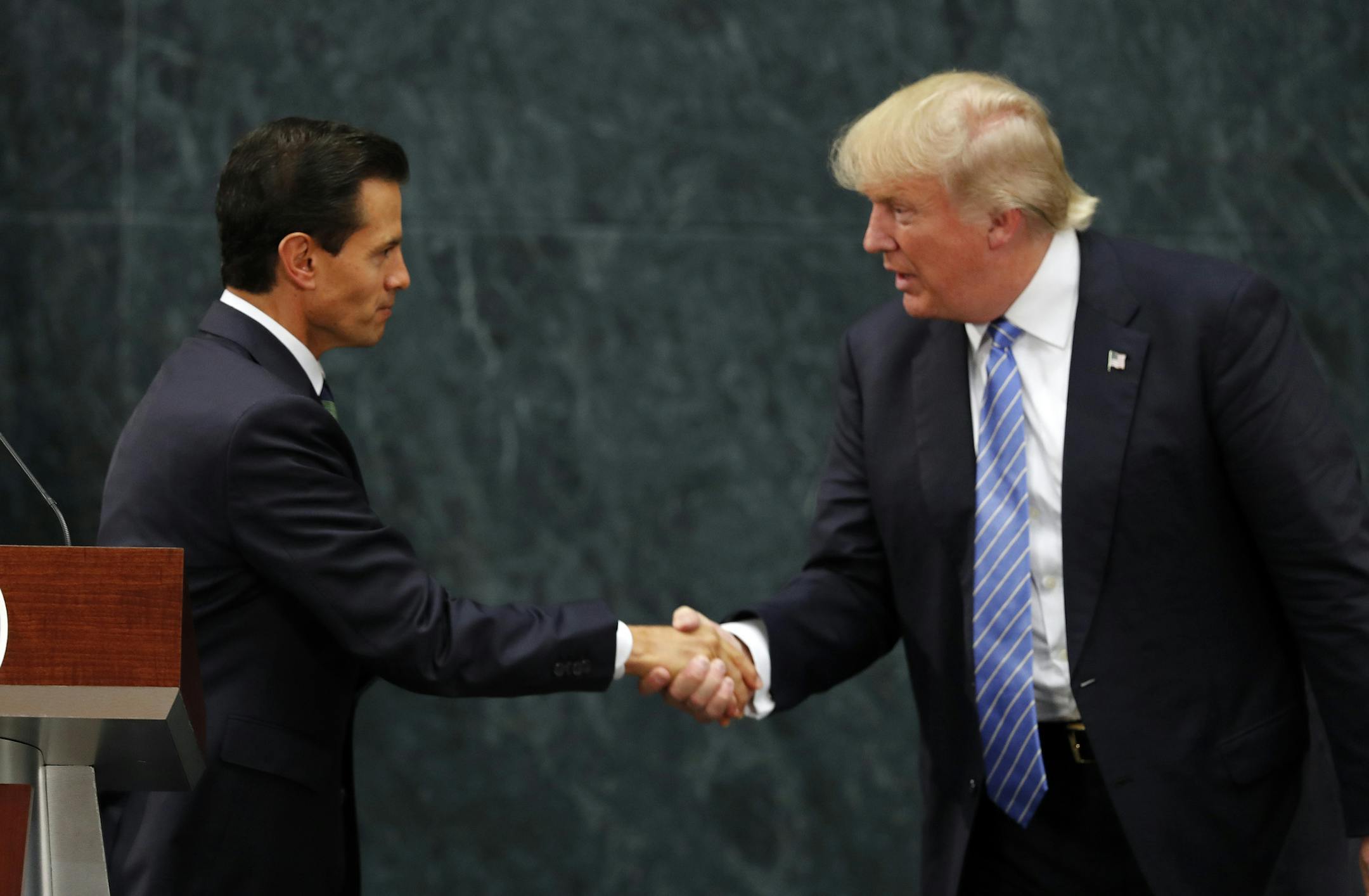 Mexico President Enrique Pena Nieto and Republican presidential nominee Donald Trump shake hands after a joint statement at Los Pinos, the presidential official residence, in Mexico City, Wednesday, Aug. 31, 2016. Trump is calling his surprise visit to Mexico City Wednesday a 'great honor.' The Republican presidential nominee said after meeting with Pena Nieto that the pair had a substantive, direct and constructive exchange of ideas.(AP Photo/Dario Lopez-Mills)