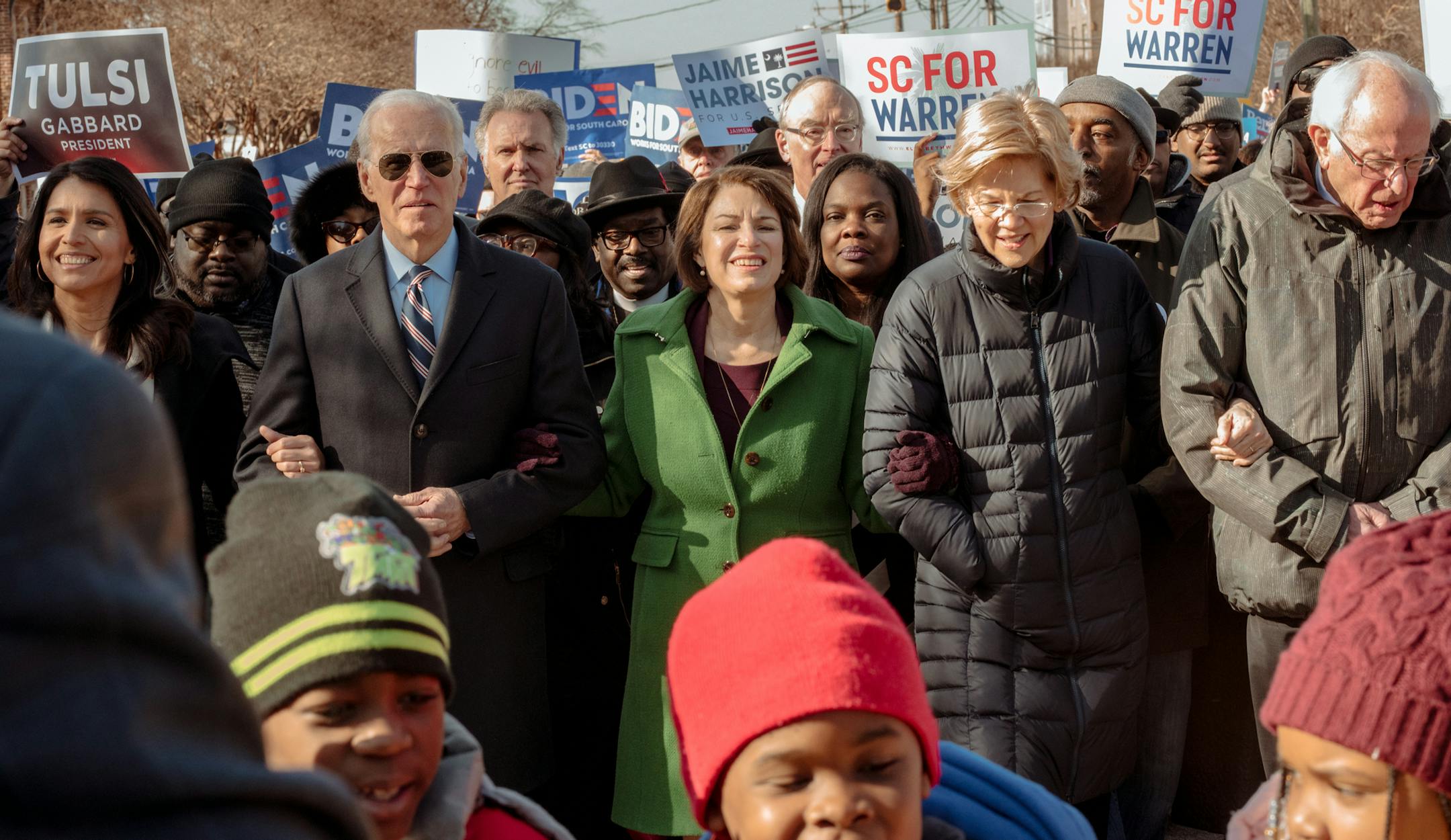 From left, candidates for the Democratic nomination for president: Rep. Tulsi Gabbard (D-Hawaii), former Vice President Joe Biden, Sen. Amy Klobuchar (D-Minn.), Sen. Elizabeth Warren (D-Mass.), and Sen. Bernie Sanders, march at a Martin Luther King Jr. Day event in Columbia, S.C. on Monday, Jan. 20, 2020. (Mike Belleme/The New York Times)
