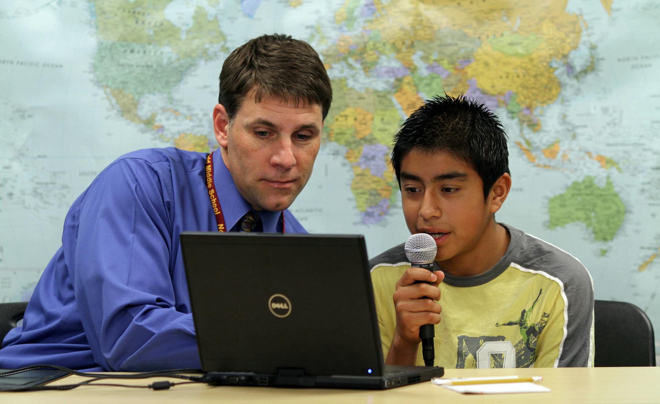 BRUCE BISPING • bbisping@startribune.com Northfield, MN., Thursday, 6/10/10] (left to right) Northfield Middle School Principal Jeff Pesta worked with student Jose Alfredo Bravo-Barojas on a laptop using SpeechGear's real-time English/Spanish translator. The Northfield based SpeechGear has created a program tha transcribes, in real time, what is being said aloud or typed onto a keyboard. The Northfield School District is using the softwar to help ESL students who don't know much english,