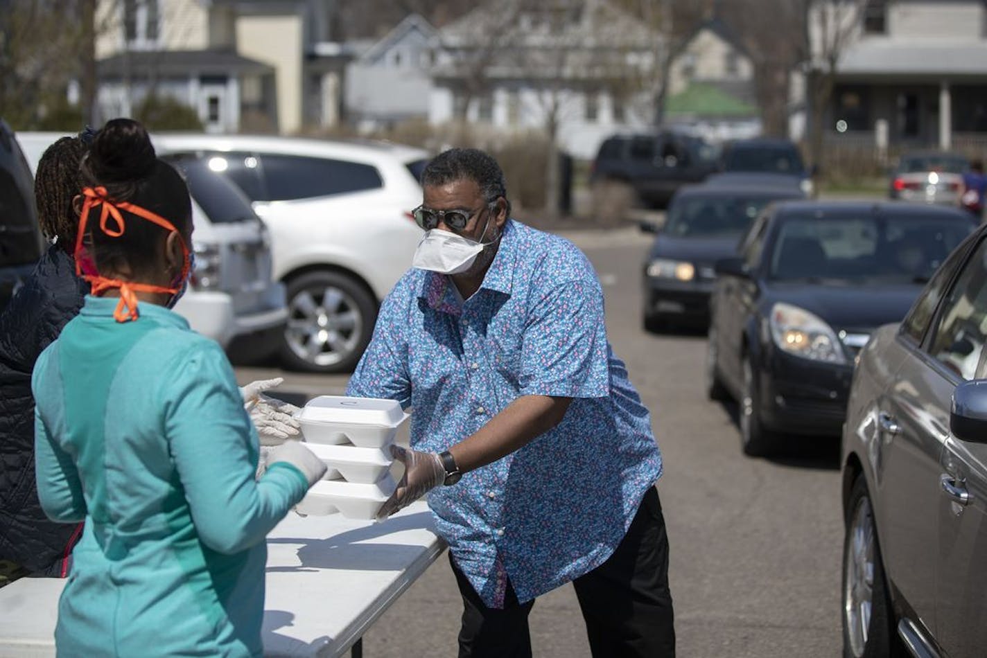 Clarence Castile and his wife, Lisa Castile, passed out chicken and rib dinner to residents of the Frogtown neighborhood in St. Paul. The food was cooked and donated by Los Ocampo restaurant.