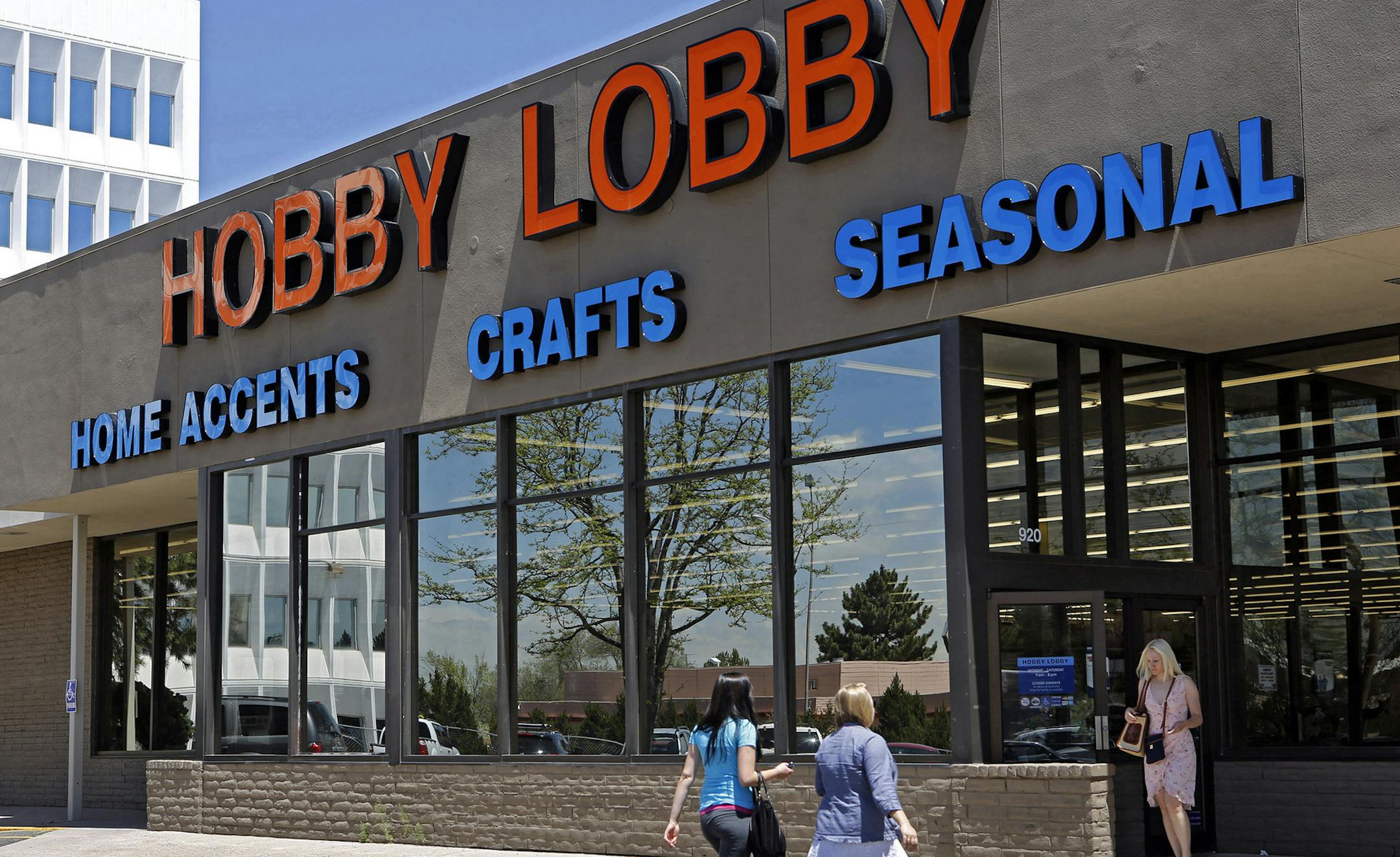 FILE - This May 22, 2013 file photo shows customer at a Hobby Lobby store in Denver. The Supreme Court has agreed to referee another dispute over President Barack Obama's health care law, whether businesses can use religious objections to escape a requirement to cover birth control for employees. The justices said Tuesday they will take up an issue that has divided the lower courts in the face of roughly 40 lawsuits from for-profit companies asking to be spared from having to cover some or all f