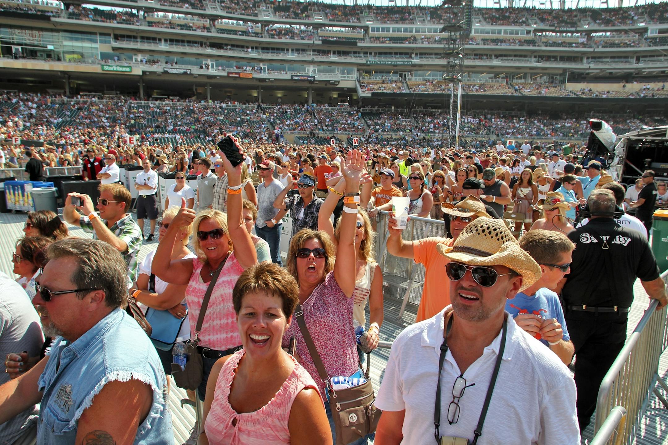 Nearly 40,000 concertgoers packed into Target Field for the ballpark's first music event. Fans enjoyed seats on the field and beer stands in the dugouts.