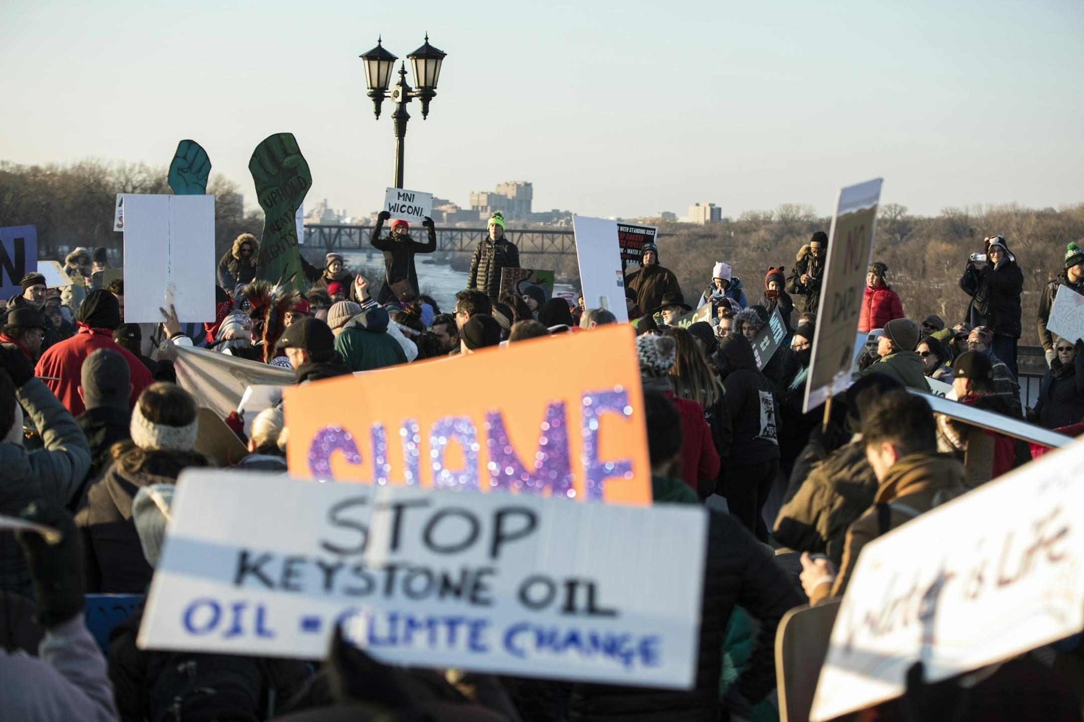Close to 500 people gathered in the middle of the Marshall Avenue Bridge (Lake Street) to protest the Dakota Access Pipeline on the border of Minneapolis and St. Paul, Minn., on Friday, January 27, 2016.