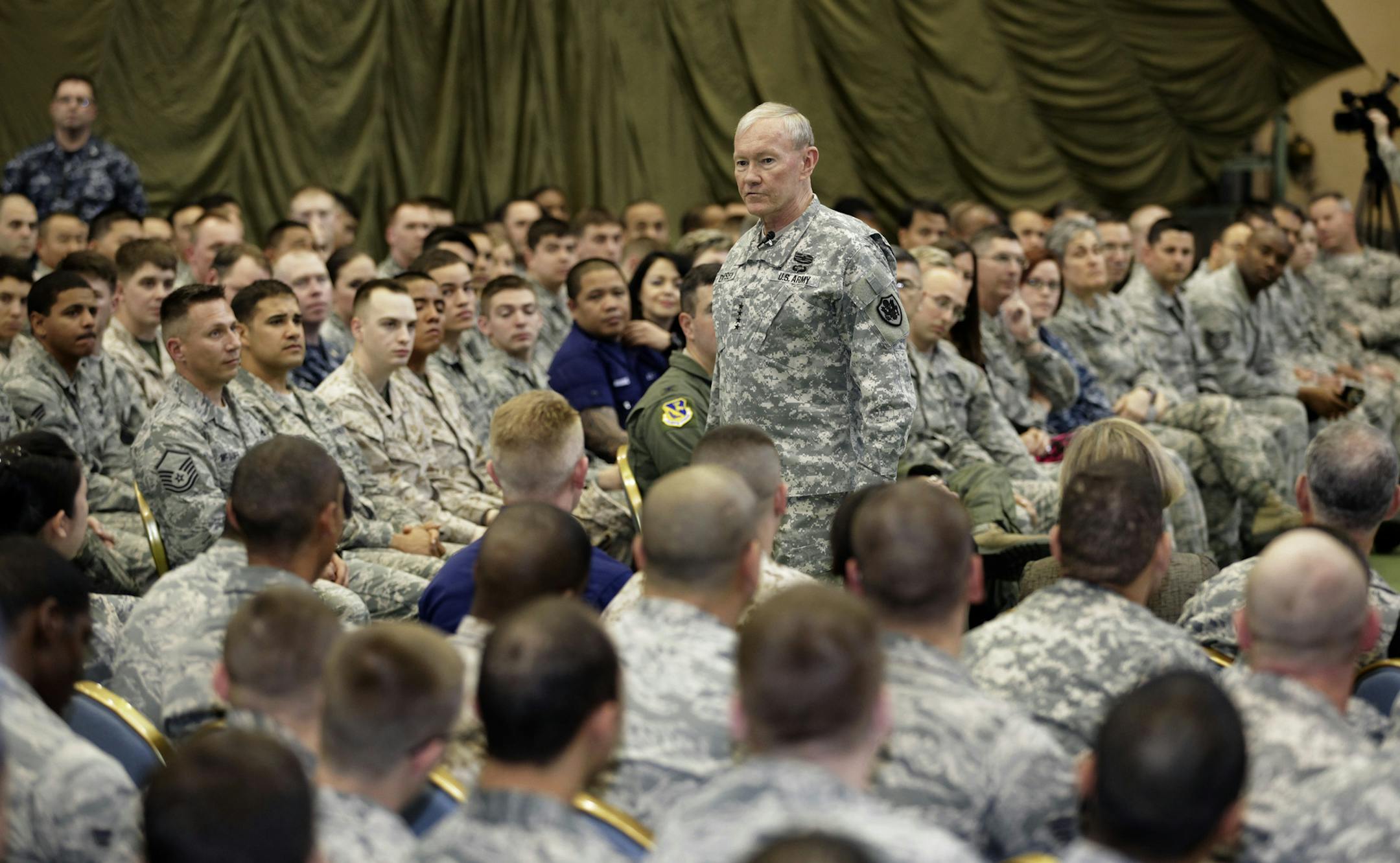 FILE - In this April 25, 2013 file photo, Joint Chiefs Chairman Gen. Martin Dempsey speaks to soldiers of the U.S. Armed Forces in Japan at Yokota Air Base on the outskirts of Tokyo. An Associated Press investigation into the militaryís handling of sexual assaults in Japan has found a pattern of random and inconsistent judgments in which most offenders are not incarcerated. Instead, commanders have ordered ìnonjudicial punishmentsî that ranged from docked pay to a letter of reprim