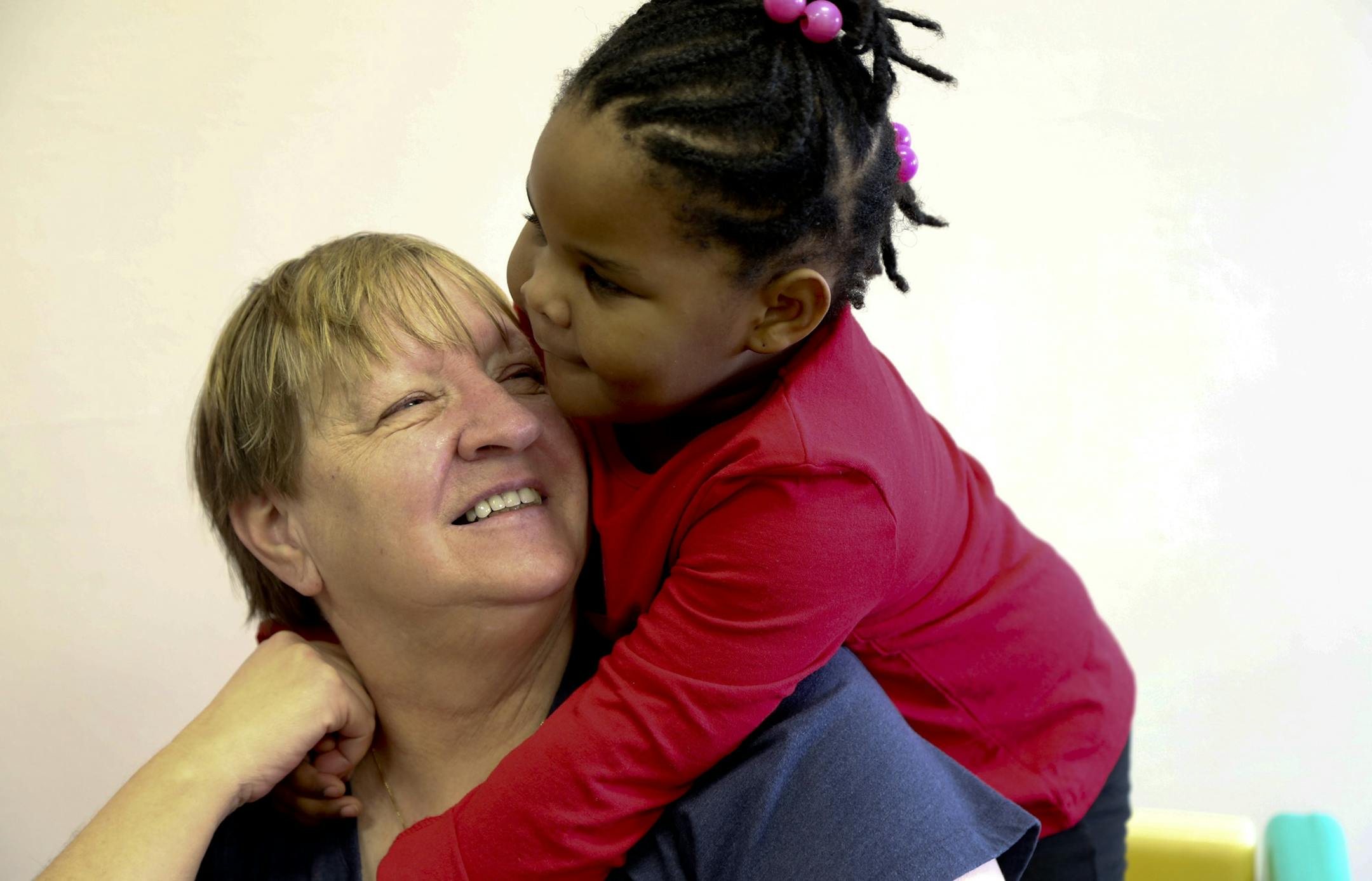 Coutrney Morgan, 3 gave assistant Judy Anderson a big hug during their play time at Family Partnership Child Care Center in Minneapolis , Min.,Wednesday, March 6, 2013. ] (KYNDELL HARKNESS/STAR TRIBUNE) kyndell.harkness@startribune.com