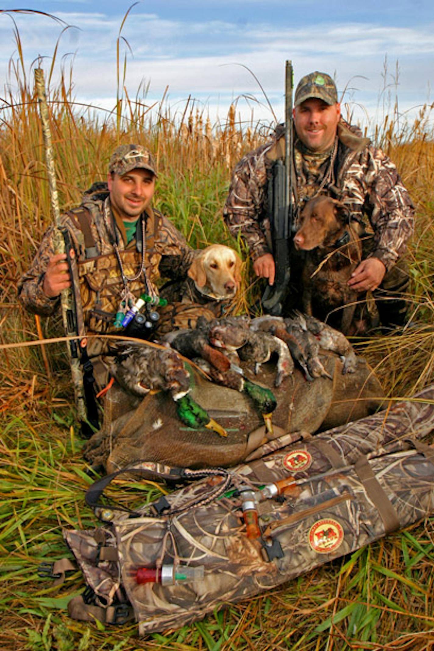 Bryan Sathre and Kevin DeLisle with an impressive bag taken over non-motorized tools. Lexi the brown lab did great work as well