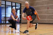 Mary Ann Goens-Bradley and Greg Hanka nearly collided as they raced for a ball during a friendly game of pickleball Thursday at the Northeast Recreati