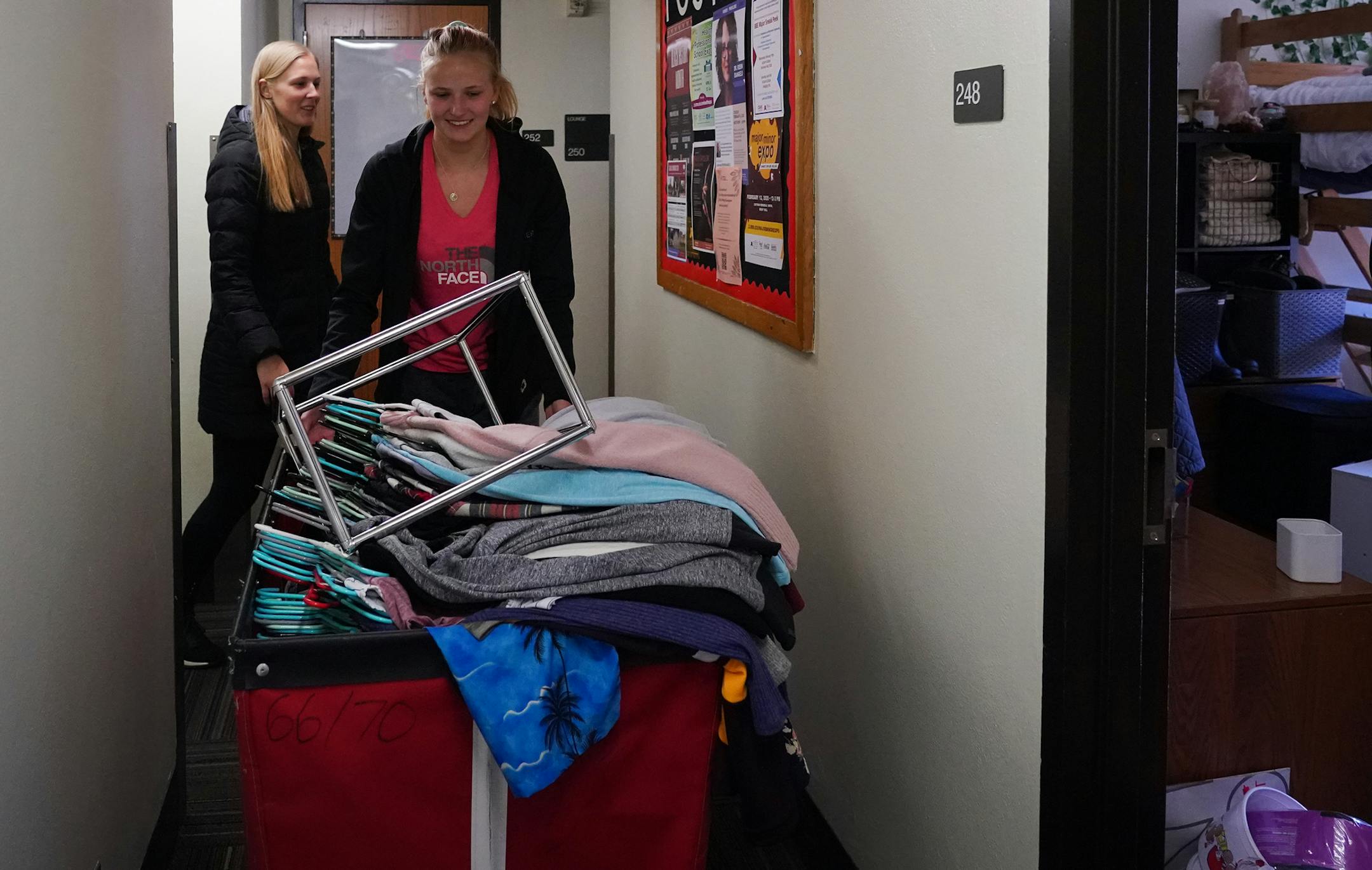 University of Minnesota senior Courtney Hruska (left) helped her younger sister Alexa, a freshman, move out of her dorm room. Both students will return to their family's home in Rochester, Minn. to continue their classes online. After spending spring break in Florida, Courtney said "We've been rearranging the house so we each have a desk to study at" when they get home. ] Shari L. Gross &#xa5; shari.gross@startribune.com Students and their families were seen moving out of campus housing at the U