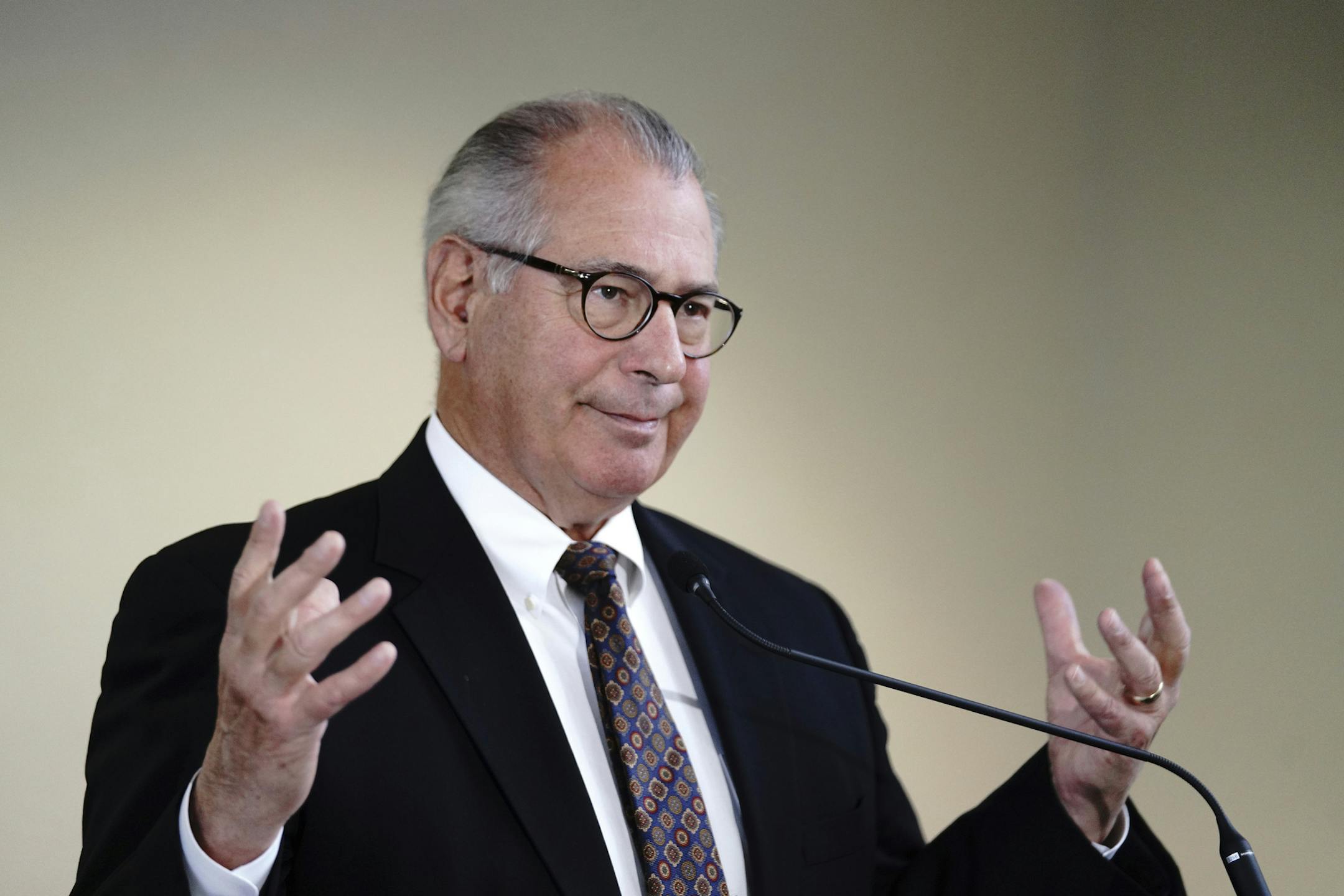 Hennepin County Minn. Attorney Mike Freeman announces charges Monday, Dec. 3, 2018 against a man who brandished a handgun and threatened a group of Somali teens at a McDonald's in Eden Prairie in November. Lloyd Johnson, 55, was charged Monday with felony terrorist threats and not having a permit to carry his weapon. (Mark Vancleave/Star Tribune via AP)