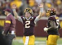 Gophers quarterback Tanner Morgan (2) celebrated after his game-winning touchdown throw to wide receiver Tyler Johnson (6) with :13 left in the fourth