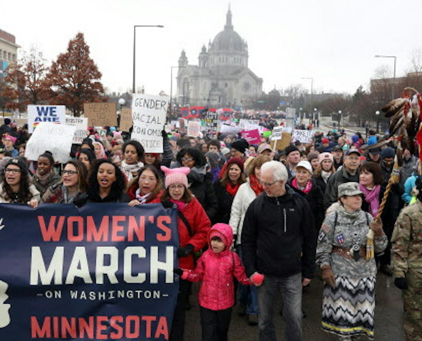 A young girl stood front and center at the front of the procession from St. Paul College to the State Capitol for the noon rally. ] ANTHONY SOUFFLE &#x2022; anthony.souffle@startribune.com Women's activists and supporters gathered at St. Paul College then marched to the State Capitol for a noon rally Saturday, Jan. 21, 2017 for a local version of the big national D.C. women's march. ORG XMIT: MIN1701211543353332