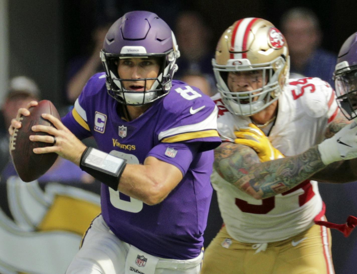 Vikings quarterback Kirk Cousins scrambles for a first down late in the fourth quarter. He cam up short, but got the ball back when the 49ers jumped off side on the next play.