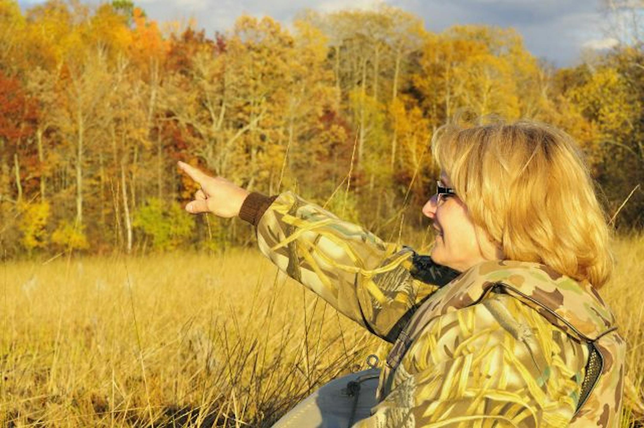 On the eve of Minnesota's duck hunting opener, Janis Anderson of Brainerd watched for ducks while scouting a wild rice marsh.