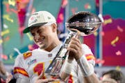 Kansas City Chiefs quarterback Patrick Mahomes (15) holds the trophy after their win against the Philadelphia Eagles in the NFL Super Bowl 57 football