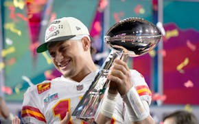 Kansas City Chiefs quarterback Patrick Mahomes (15) holds the trophy after their win against the Philadelphia Eagles in the NFL Super Bowl 57 football